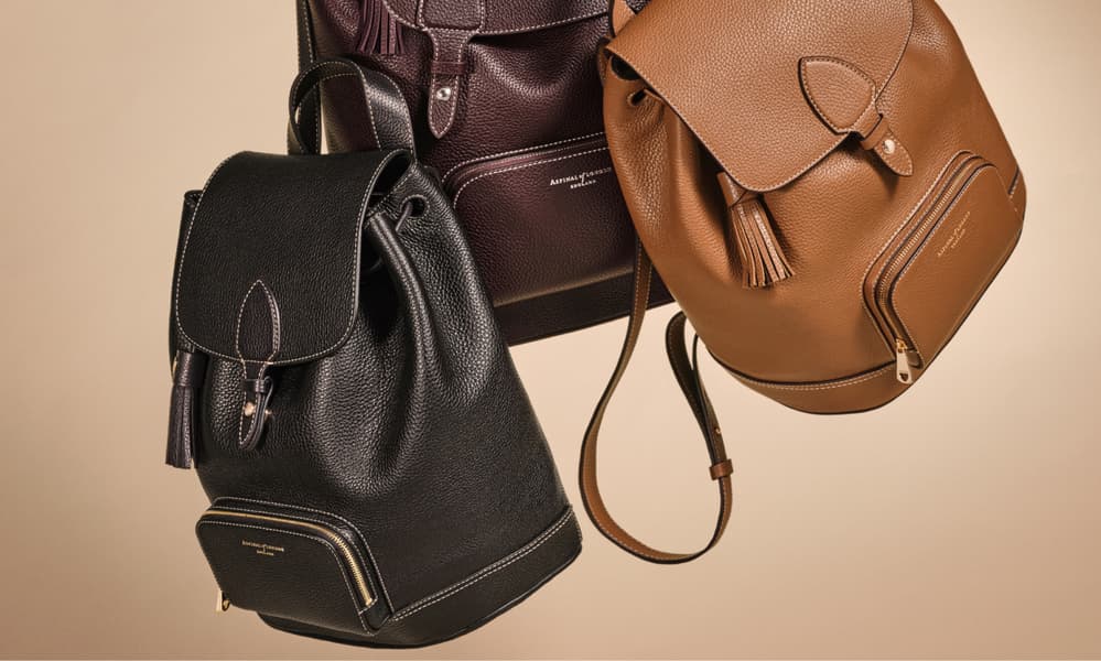 black, purple and tan backpack