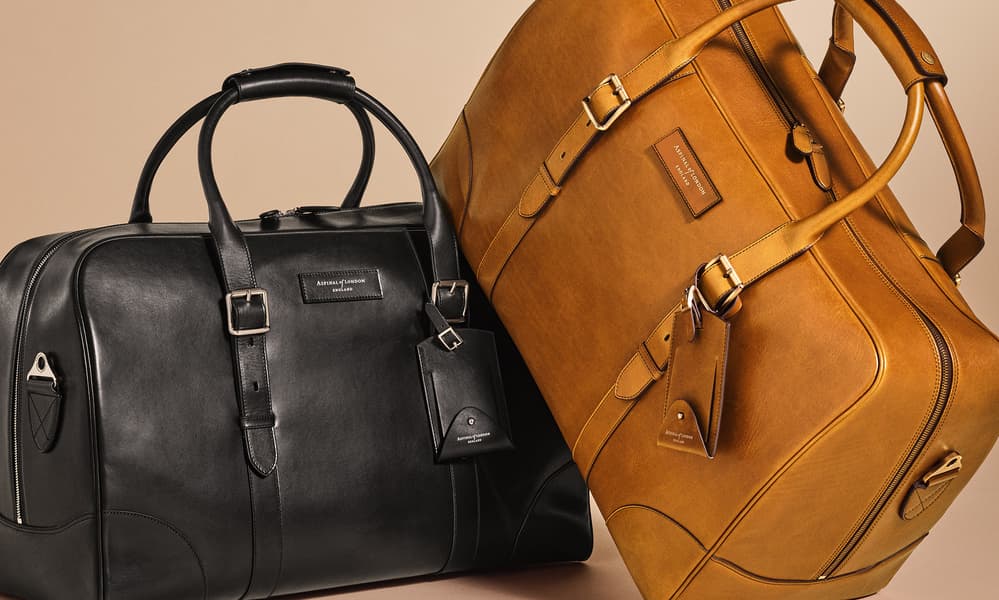 Tan and black weekender bag