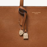 Zipped East West Tote with Shield Charm Tan Pebble