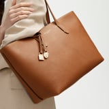 Zipped East West Tote with Shield Charm Tan Pebble