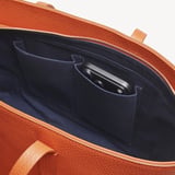 Zipped East West Tote with Shield Charm Marmalade Pebble