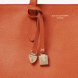 Zipped East West Tote with Shield Charm Marmalade Pebble