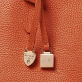 Zipped East West Tote with Shield Charm Marmalade Pebble
