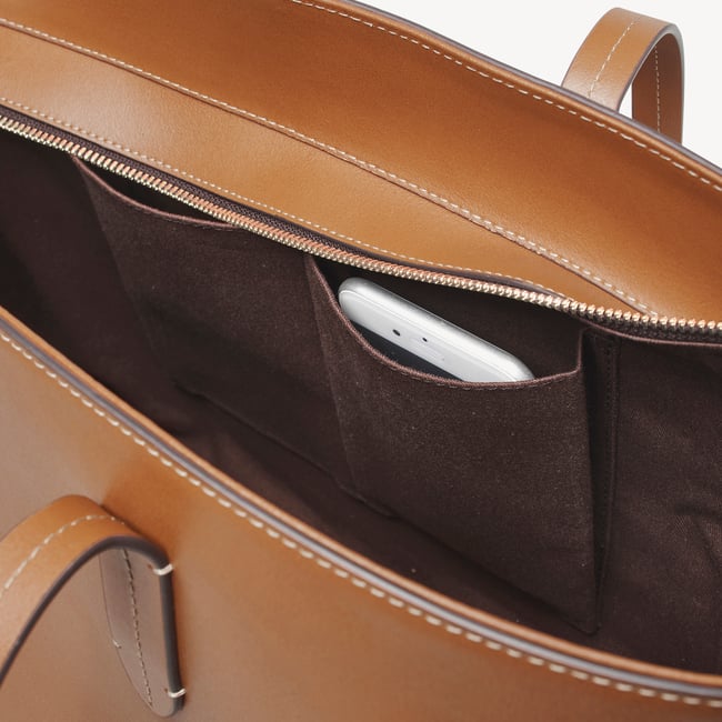 Zipped East West Tote with Shield Charm Smooth Tan