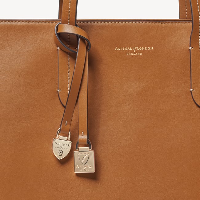 Zipped East West Tote with Shield Charm Smooth Tan