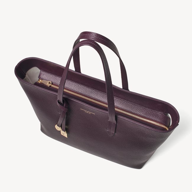 Zipped East West Tote with Shield Charm Fig Pebble