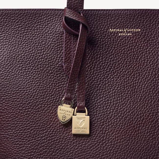 Zipped East West Tote with Shield Charm Fig Pebble