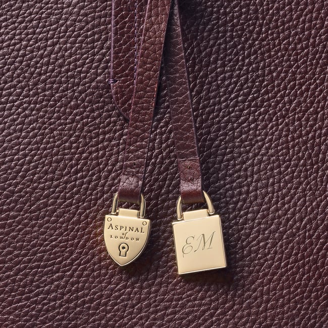 Zipped East West Tote with Shield Charm Fig Pebble
