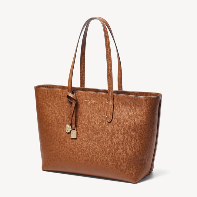 Zipped East West Tote with Shield Charm Tan Pebble