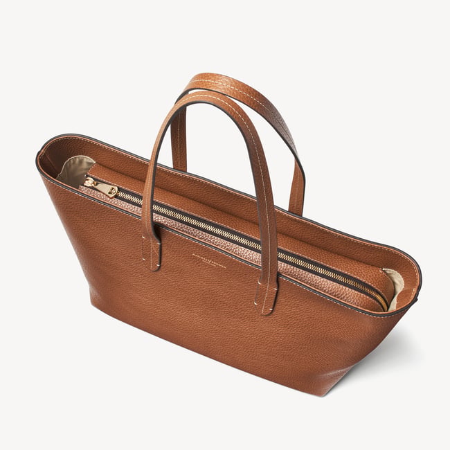 Zipped East West Tote with Shield Charm Tan Pebble