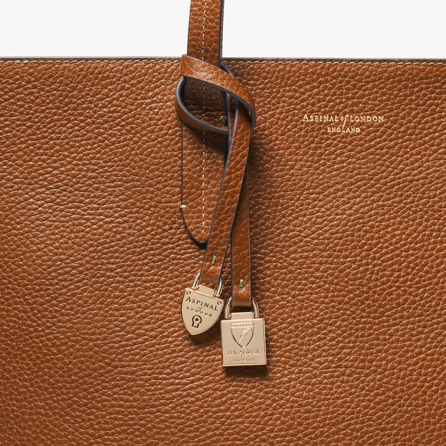 Zipped East West Tote with Shield Charm Tan Pebble