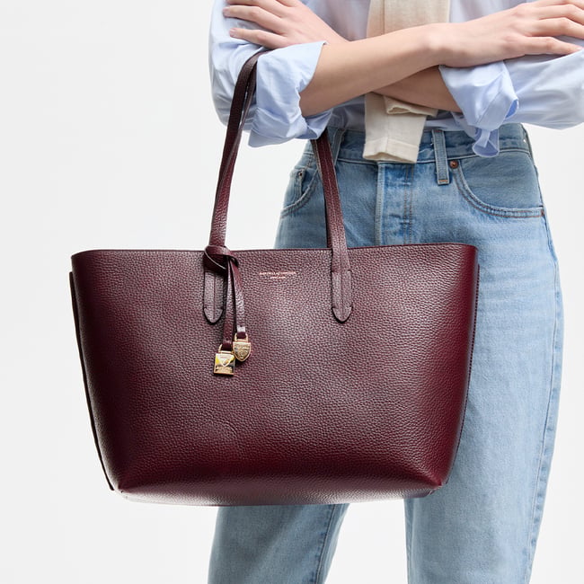 Zipped East West Tote with Shield Charm Fig Pebble