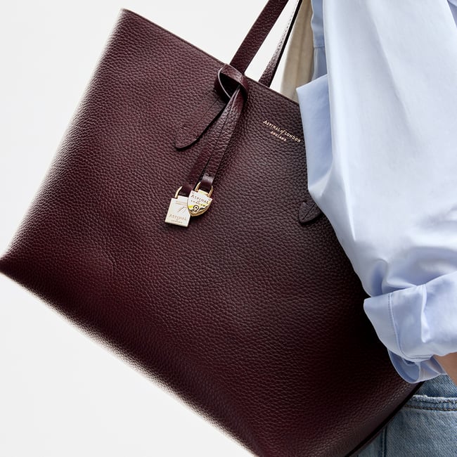 Zipped East West Tote with Shield Charm Fig Pebble