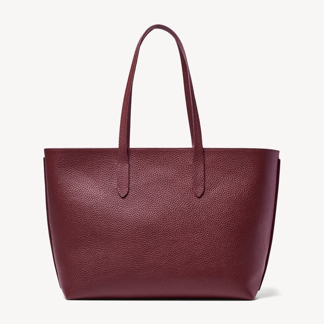Zipped East West Tote with Shield Charm Garnet Pebble
