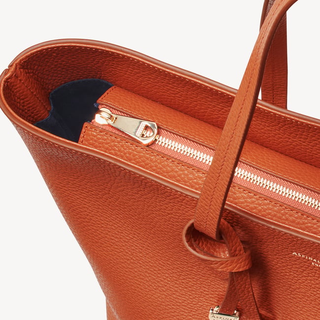 Zipped East West Tote with Shield Charm Marmalade Pebble