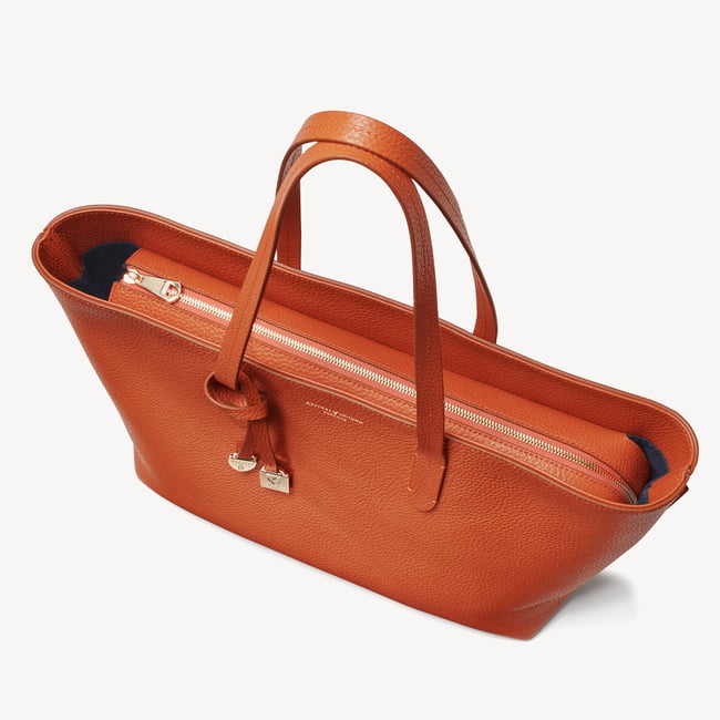 Zipped East West Tote with Shield Charm Marmalade Pebble