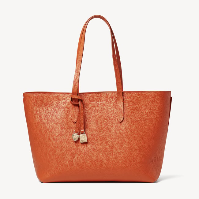 Zipped East West Tote with Shield Charm Marmalade Pebble