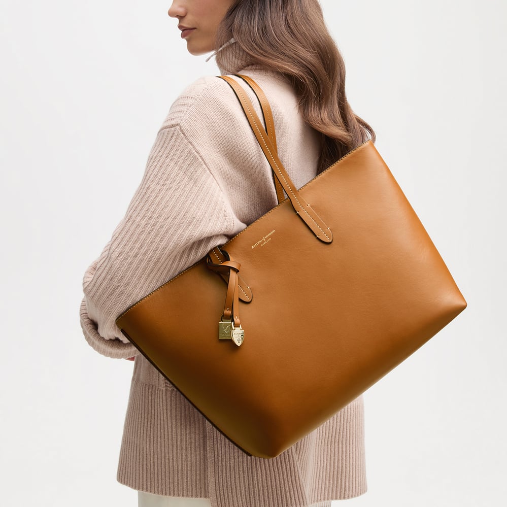 Zipped East West Tote with Shield Charm Smooth Tan