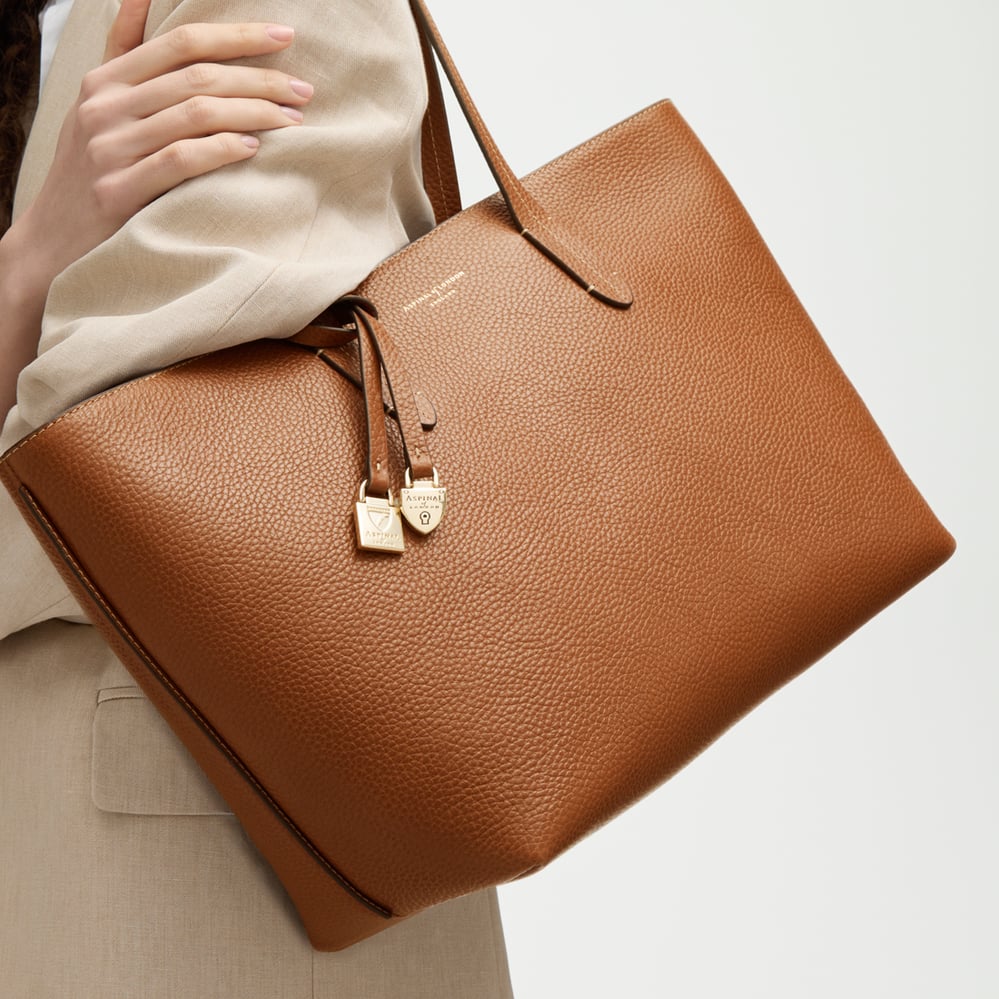 Zipped East West Tote with Shield Charm Tan Pebble