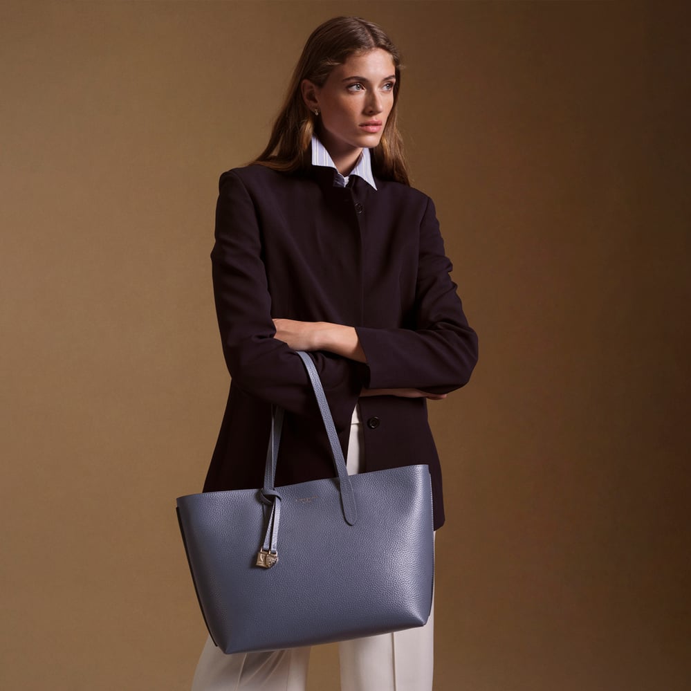 Zipped East West Tote with Shield Charm Dusky Blue Pebble