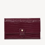 Travel Wallet in Deep Shine Garnet Small Croc from Aspinal of London