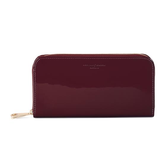 Continental Clutch Zip Wallet in Deep Shine Cherry Patent from Aspinal of London