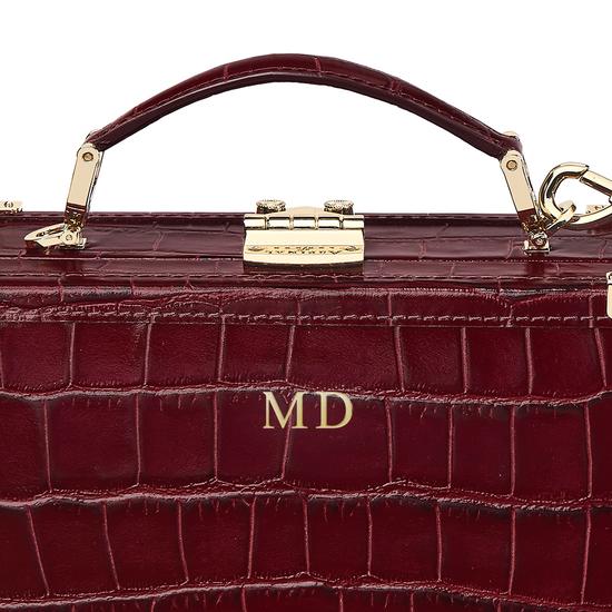 Mini Trunk Clutch in Deep Shine Bordeaux Croc with Zig Zag Strap from Aspinal of London
